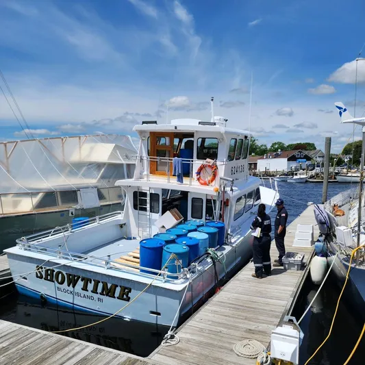  Yacht Photos Pics Fishing boat "Showtime" docked at marina, Block Island, RI, with blue barrels on deck.