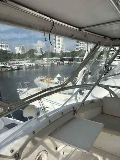  Yacht Photos Pics 1987 Bertram 50 Convertible yacht interior with marina view.