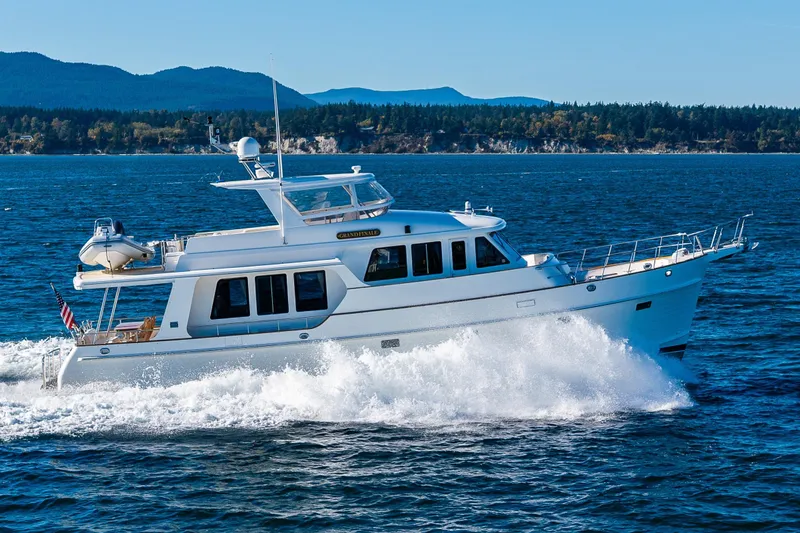 Grand Finale Yacht Photos Pics 2007 Grand Banks 59 Aleutian Raised Pilothouse yacht cruising on open water.