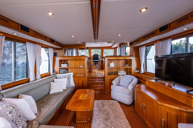 Grand Finale Yacht Photos Pics Luxurious interior of 2007 Grand Banks 59 Aleutian Raised Pilothouse yacht with elegant wood finishes.