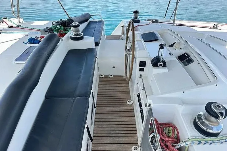  Yacht Photos Pics Cockpit of 2008 Lagoon 500 catamaran with wooden deck and steering wheel.