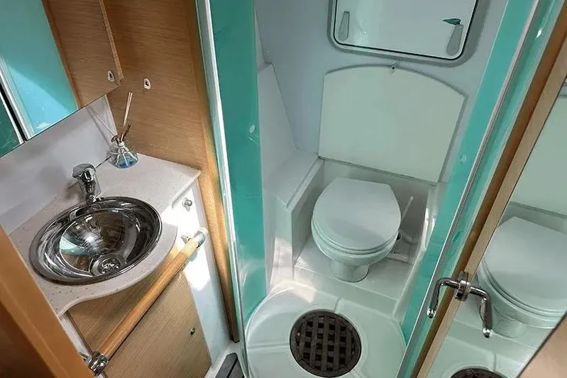  Yacht Photos Pics Compact bathroom in 2008 Lagoon 500 yacht with sink and toilet.