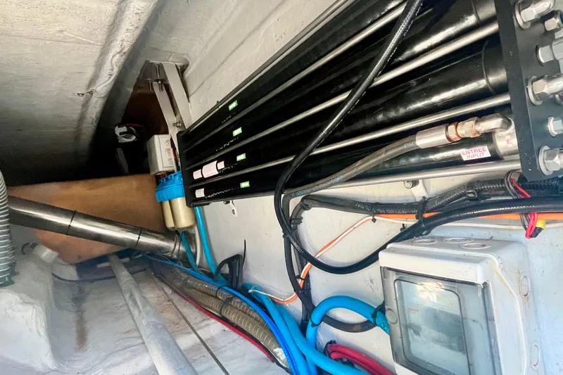  Yacht Photos Pics Engine room of a 2008 Lagoon 500 yacht with visible pipes and wiring.