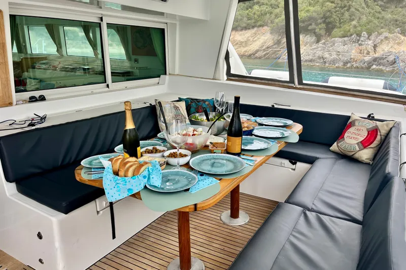  Yacht Photos Pics Luxurious dining setup on 2008 Lagoon 500 yacht with scenic ocean view.