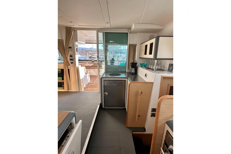  Yacht Photos Pics Interior of 2008 Lagoon 500 yacht featuring modern kitchen and dining area.