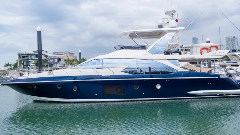  Yacht Photos Pics 2017 Azimut 66 FLY yacht docked in marina, sleek design, blue hull, luxury vessel.