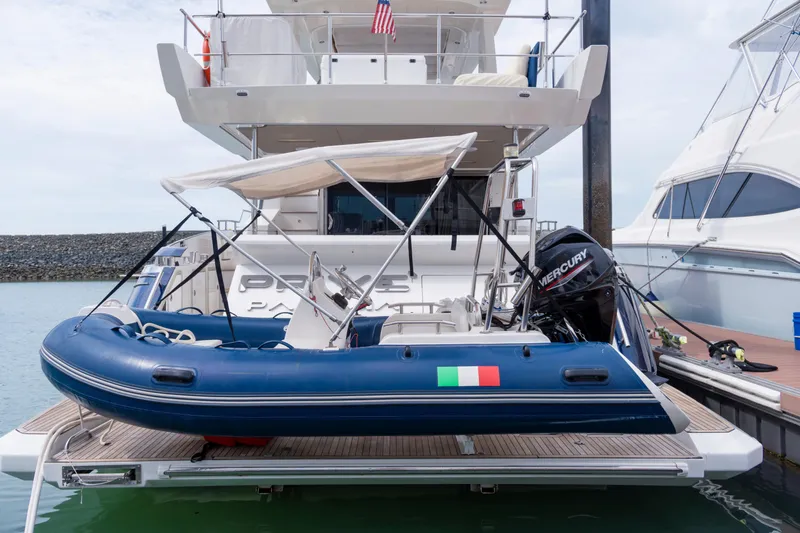  Yacht Photos Pics Azimut 66 FLY 2017 yacht with inflatable boat and Mercury engine docked at marina.