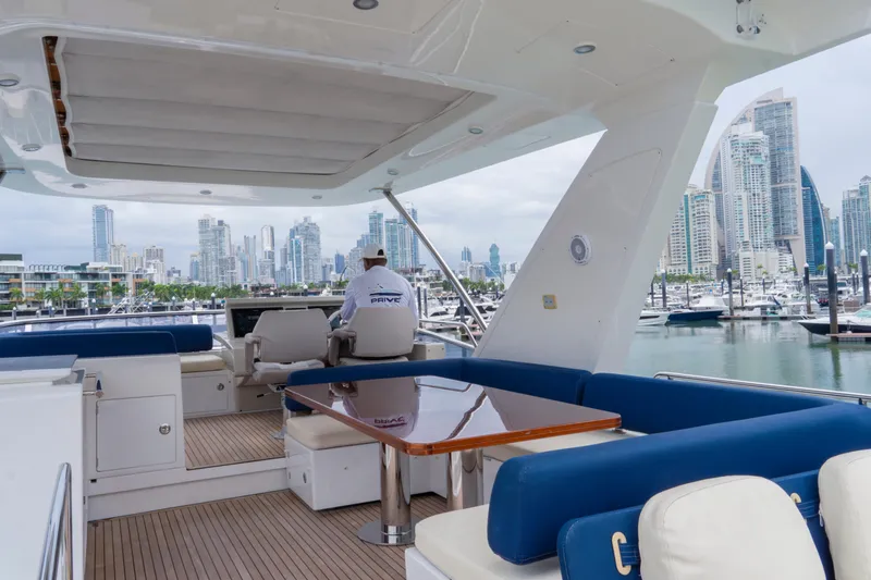  Yacht Photos Pics Luxurious 2017 Azimut 66 FLY yacht with spacious deck, marina view, and city skyline backdrop.