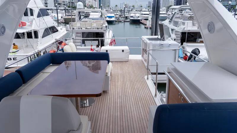  Yacht Photos Pics Luxurious 2017 Azimut 66 FLY yacht deck with elegant seating and marina view.