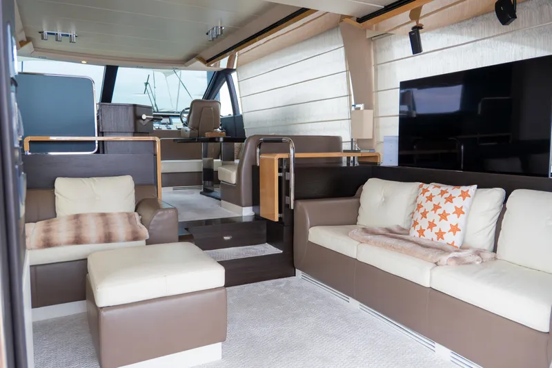  Yacht Photos Pics Luxurious interior of 2017 Azimut 66 FLY yacht with modern seating and large windows.
