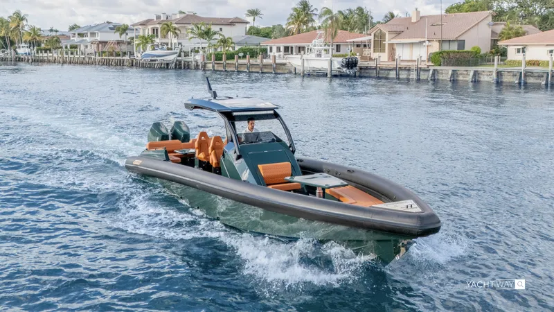 2025 Skipper 38 Twin 400 - Rolls-royce Limited Ed Yacht Photos Pics 2025 Skipper-BSK 38NC luxury yacht cruising near waterfront homes.