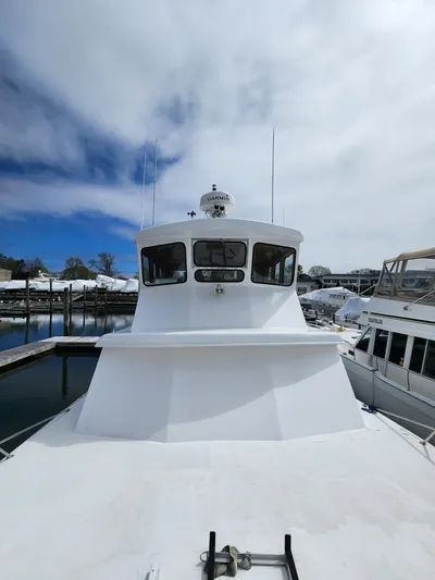  Yacht Photos Pics 1980 Tuna Rose Brothers boat docked under cloudy sky.