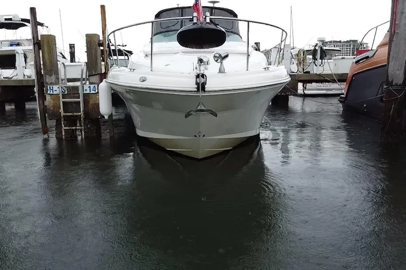  Yacht Photos Pics 2004 Sea Ray 340 Sundancer docked at marina, front view.