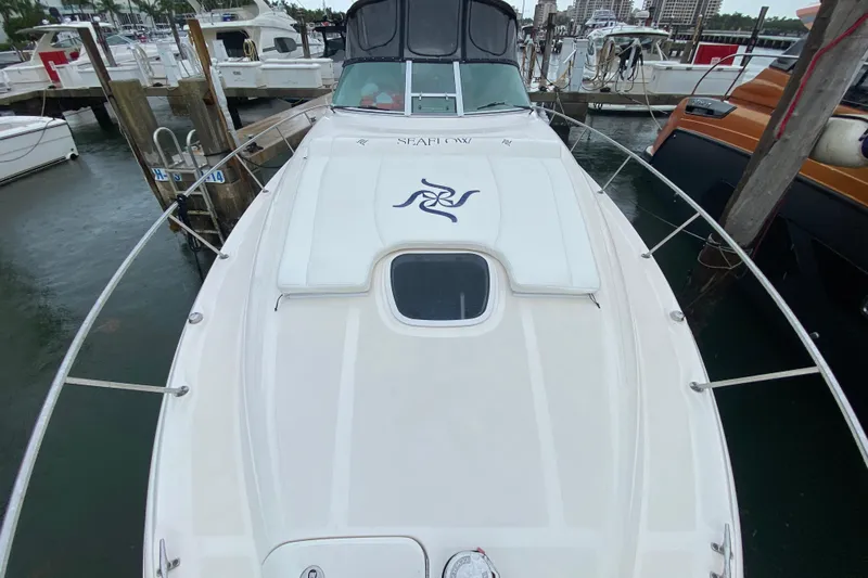  Yacht Photos Pics 2004 Sea Ray 340 Sundancer docked at marina, view from bow.