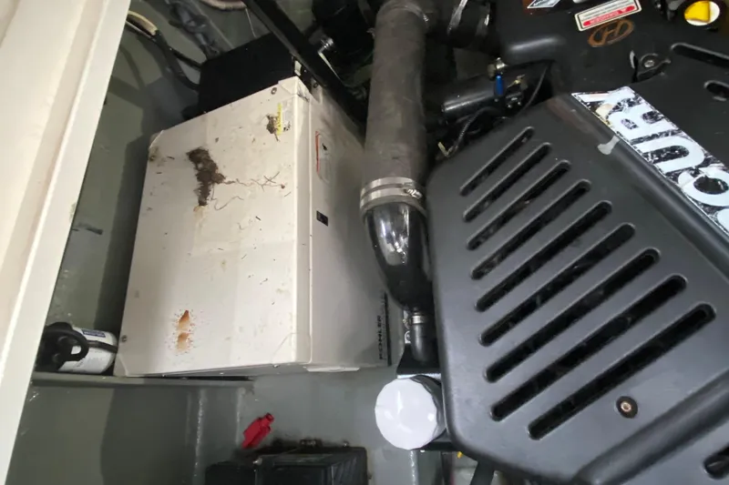  Yacht Photos Pics Engine compartment of a 2004 Sea Ray 340 Sundancer boat, showing machinery and components.