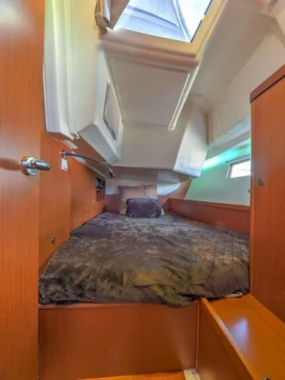 Sv Tonic III Yacht Photos Pics Cozy cabin interior of 2012 Beneteau Oceanis 41.1 sailboat with wooden finish and skylight.