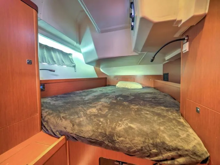 Sv Tonic III Yacht Photos Pics Cozy cabin interior of 2012 Beneteau Oceanis 41.1 yacht with plush bedding.