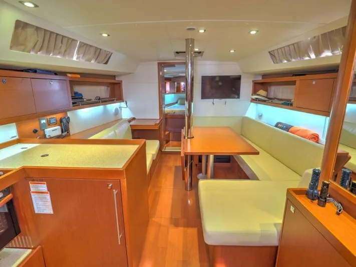Sv Tonic III Yacht Photos Pics Interior of 2012 Beneteau Oceanis 41.1 yacht with modern wood finish and cozy seating.