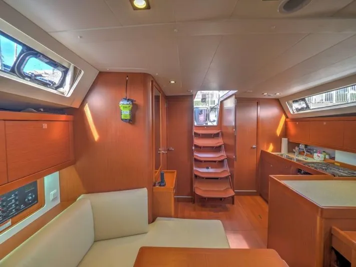 Sv Tonic III Yacht Photos Pics Interior of 2012 Beneteau Oceanis 41.1 yacht, featuring cozy seating and modern kitchen area.
