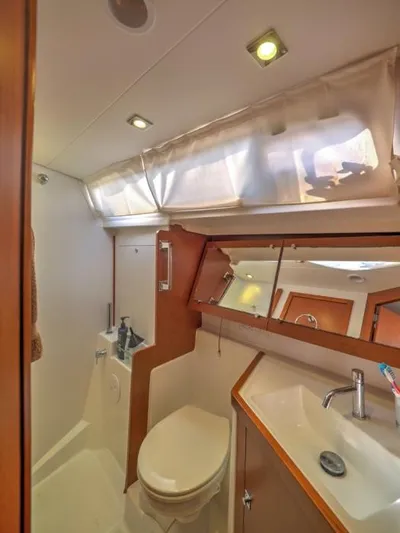 Sv Tonic III Yacht Photos Pics Beneteau Oceanis 41.1 2012 yacht bathroom with modern fixtures and natural lighting.