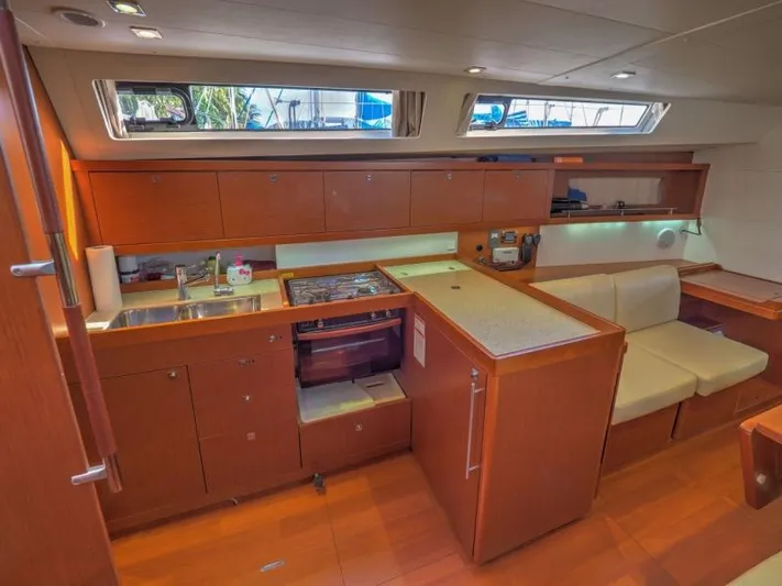 Sv Tonic III Yacht Photos Pics Interior of 2012 Beneteau Oceanis 41.1 yacht, featuring a modern kitchen and seating area.