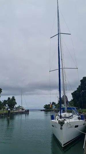 Sv Tonic III Yacht Photos Pics Beneteau Oceanis 41.1 sailboat docked in a serene marina, overcast sky, 2012 model.