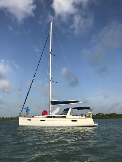 Sv Tonic III Yacht Photos Pics Sailing yacht Beneteau Oceanis 41.1, 2012 model, on calm waters under a blue sky.