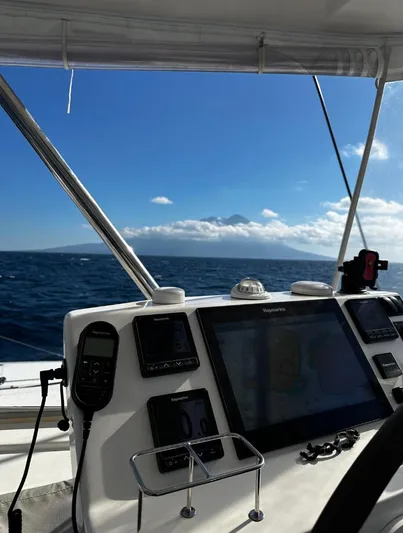 Oe Hani Yacht Photos Pics Sailing on a 2018 Leopard 58 yacht with ocean and mountain view.