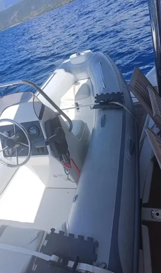 Oe Hani Yacht Photos Pics Inflatable boat on Leopard 58 yacht, 2018 model, floating on blue ocean water.