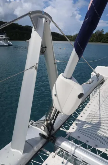 Oe Hani Yacht Photos Pics Sailboat rigging on a 2018 Leopard 58 catamaran, anchored in a serene bay.