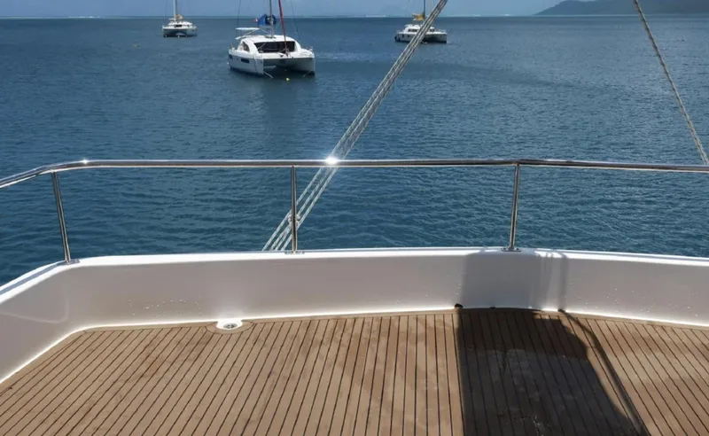 Oe Hani Yacht Photos Pics Deck view from a 2018 Leopard 58 yacht overlooking calm ocean waters.