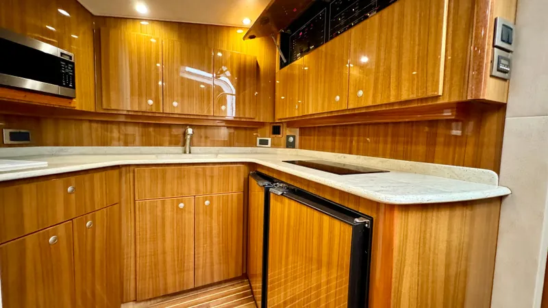  Yacht Photos Pics Interior of 2012 Viking 42 Open yacht with elegant wood finish.