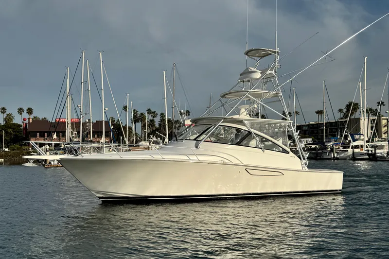  Yacht Photos Pics 2012 Viking 42 Open yacht docked in marina with sailboats in background.