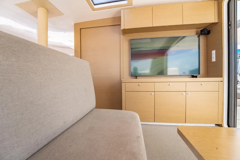 Big Bird Yacht Photos Pics Interior of 2021 NEEL 47 yacht with modern furnishings and built-in TV.