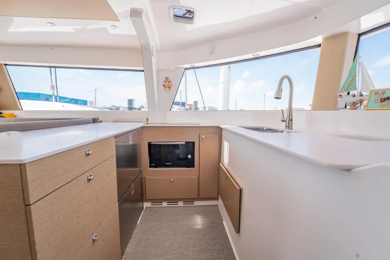 Big Bird Yacht Photos Pics Modern NEEL 47 yacht kitchen interior with sleek cabinetry and appliances, 2021 model.