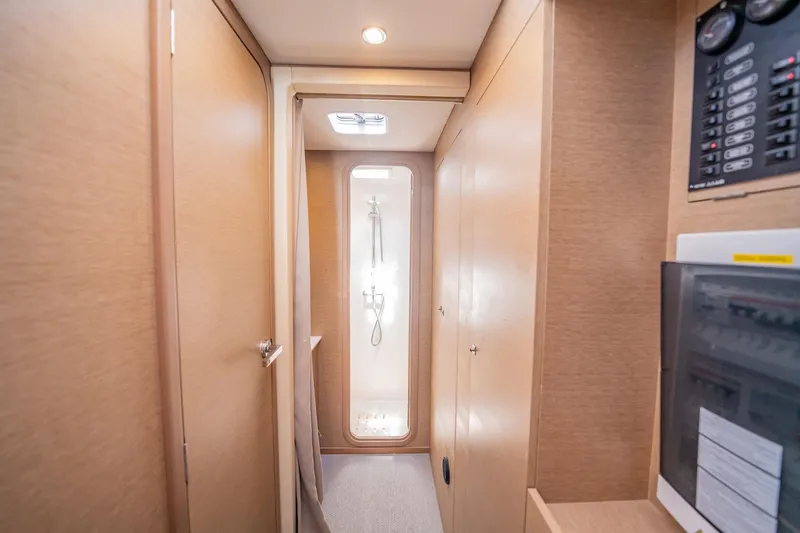 Big Bird Yacht Photos Pics Interior of 2021 NEEL 47 yacht, featuring a modern hallway and shower area.