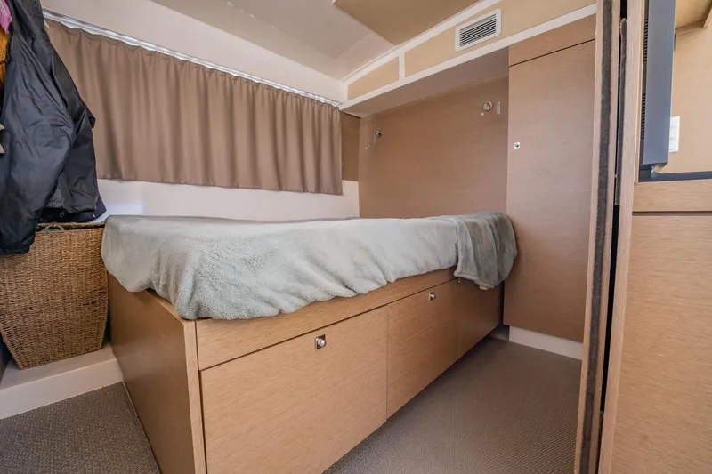 Big Bird Yacht Photos Pics Cozy cabin interior of 2021 NEEL 47 with bed and storage.