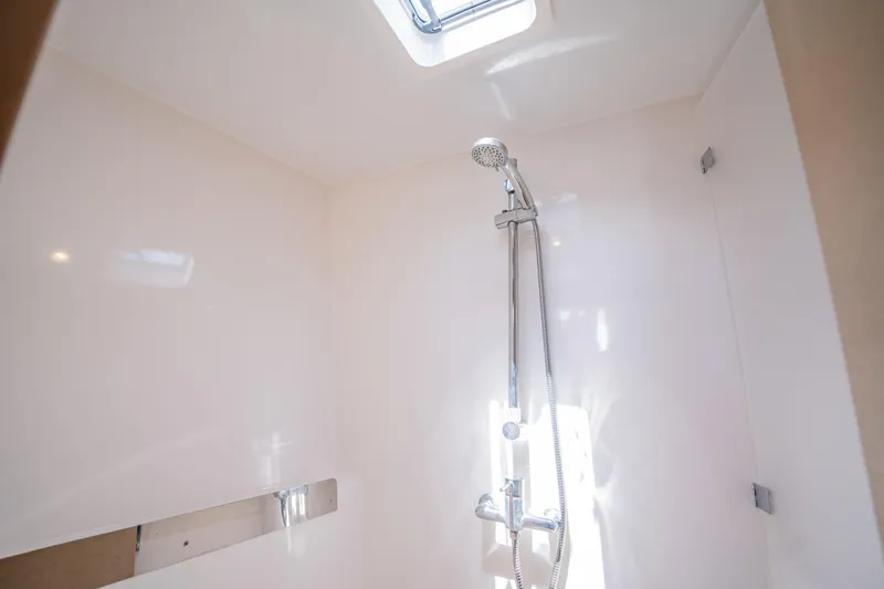 Big Bird Yacht Photos Pics Modern shower area in NEEL 47, 2021 model, with sleek fixtures and natural light.