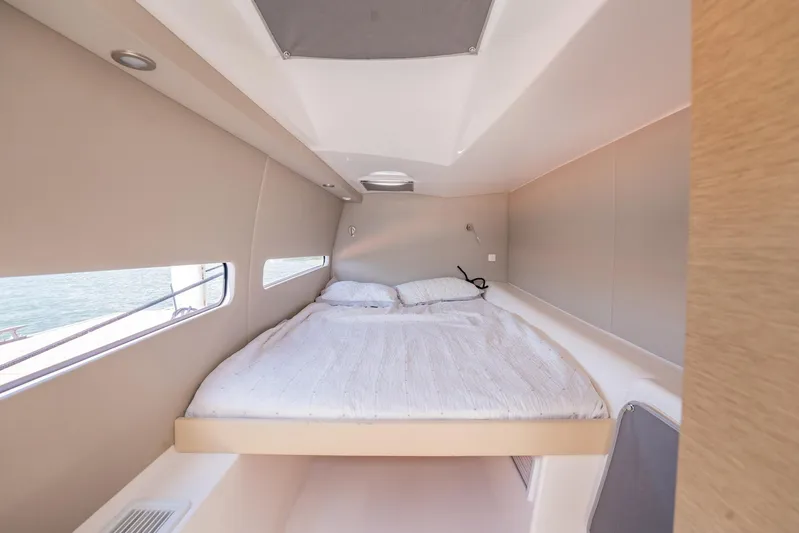 Big Bird Yacht Photos Pics Interior cabin of 2021 NEEL 47 with a cozy bed and modern design.