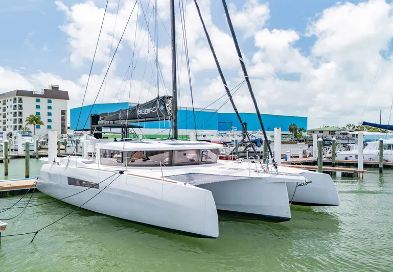 Big Bird Yacht Photos Pics 2021 NEEL 47 trimaran docked at marina under blue sky.