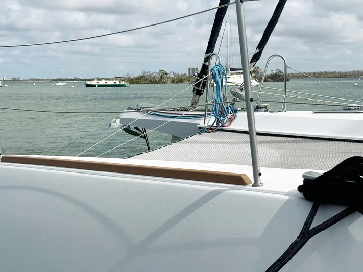 Big Bird Yacht Photos Pics Trimaran NEEL 47 sailing on calm waters, showcasing deck and rigging, 2021 model.