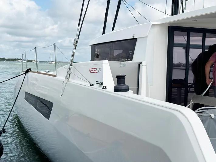 Big Bird Yacht Photos Pics 2021 NEEL 47 trimaran docked, showcasing sleek design and modern features.