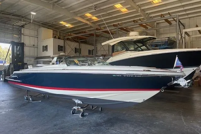 Yacht Photos Pics 2024 Chris-Craft Launch 27 boat in a spacious indoor storage facility.