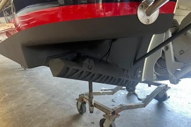  Yacht Photos Pics 2024 Chris-Craft Launch 27 boat on a wheeled stand, showcasing the hull and propeller area.