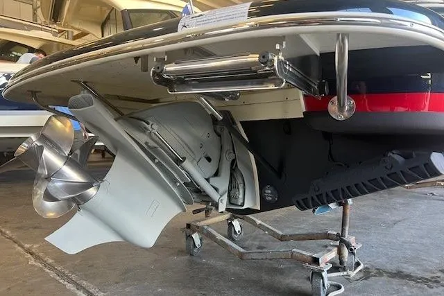  Yacht Photos Pics 2024 Chris-Craft Launch 27 boat with visible propeller and stern drive in a garage.