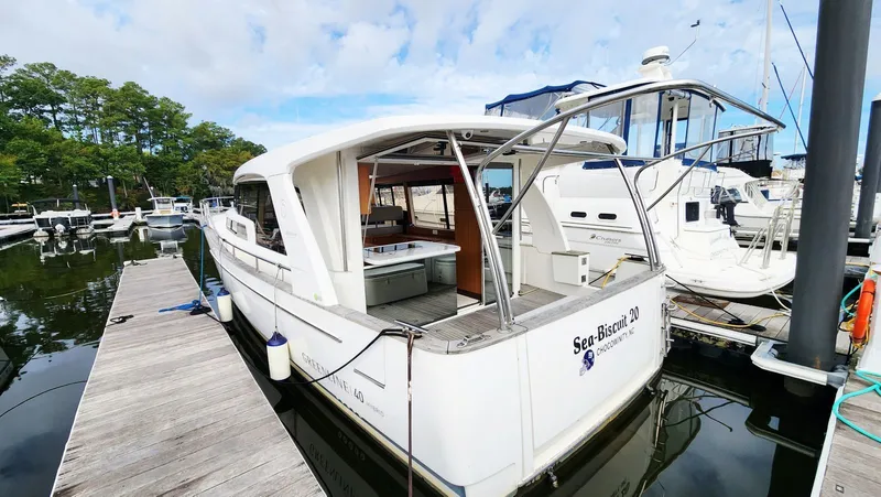 Sea-solar Sue & Lectric Lee Yacht Photos Pics 2022 Greenline 40 yacht docked at marina, open deck view.