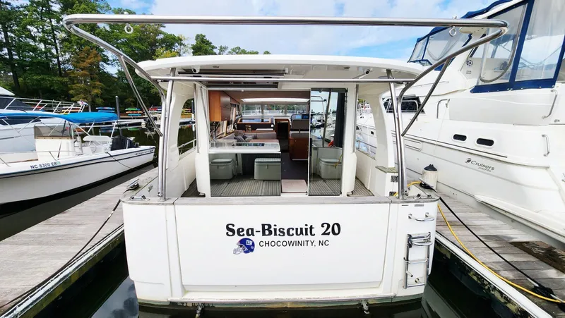 Sea-solar Sue & Lectric Lee Yacht Photos Pics 2022 Greenline 40 yacht docked, rear view, named "Sea-Biscuit 20" in Chocowinity, NC.