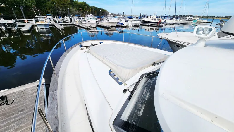 Sea-solar Sue & Lectric Lee Yacht Photos Pics 2022 Greenline 40 yacht docked at a marina with other boats.