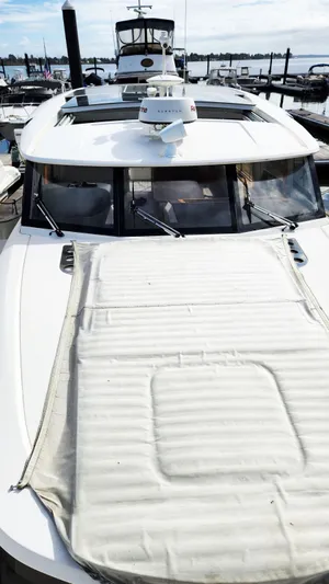 Sea-solar Sue & Lectric Lee Yacht Photos Pics 2022 Greenline 40 yacht docked at marina, showcasing sleek design and modern features.