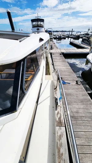 Sea-solar Sue & Lectric Lee Yacht Photos Pics 2022 Greenline 40 yacht docked at a marina under a clear blue sky.